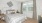 a bedroom with a bed and a fan