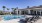 a swimming pool with chairs around it