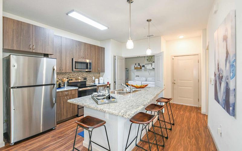 a kitchen with a table and chairs