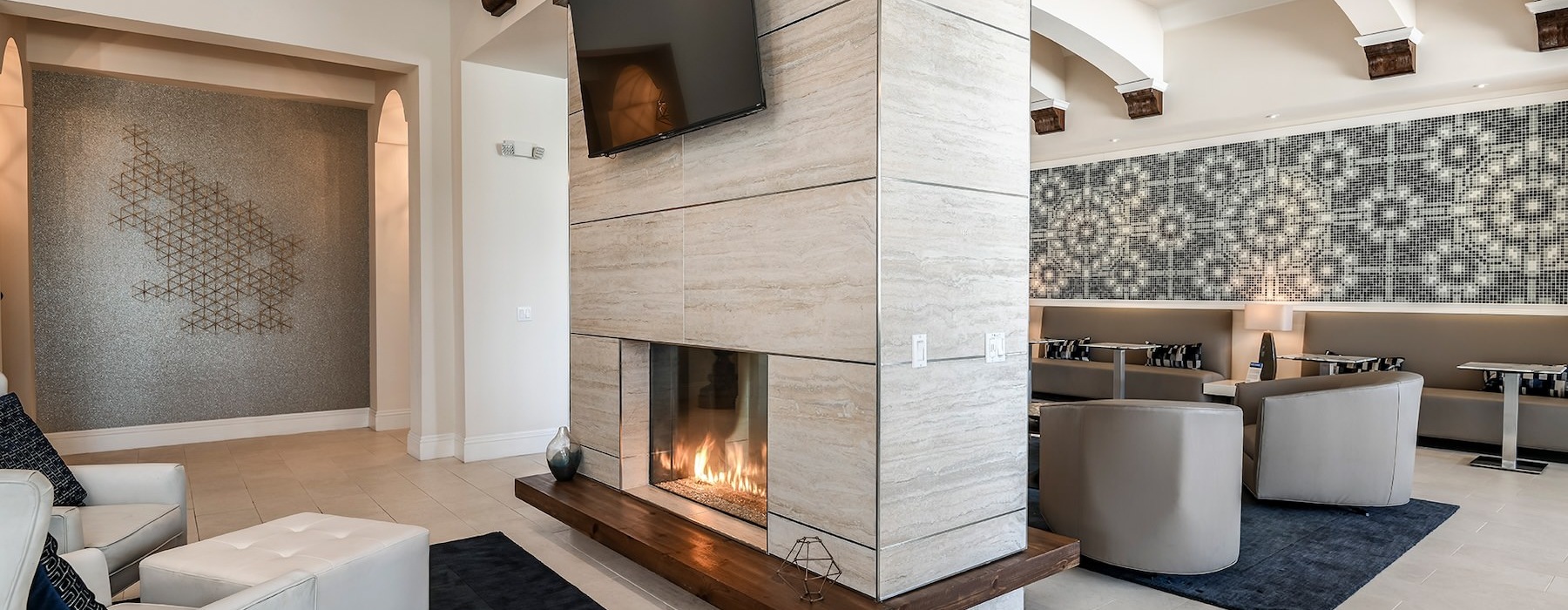 a modern looking living room with a fireplace